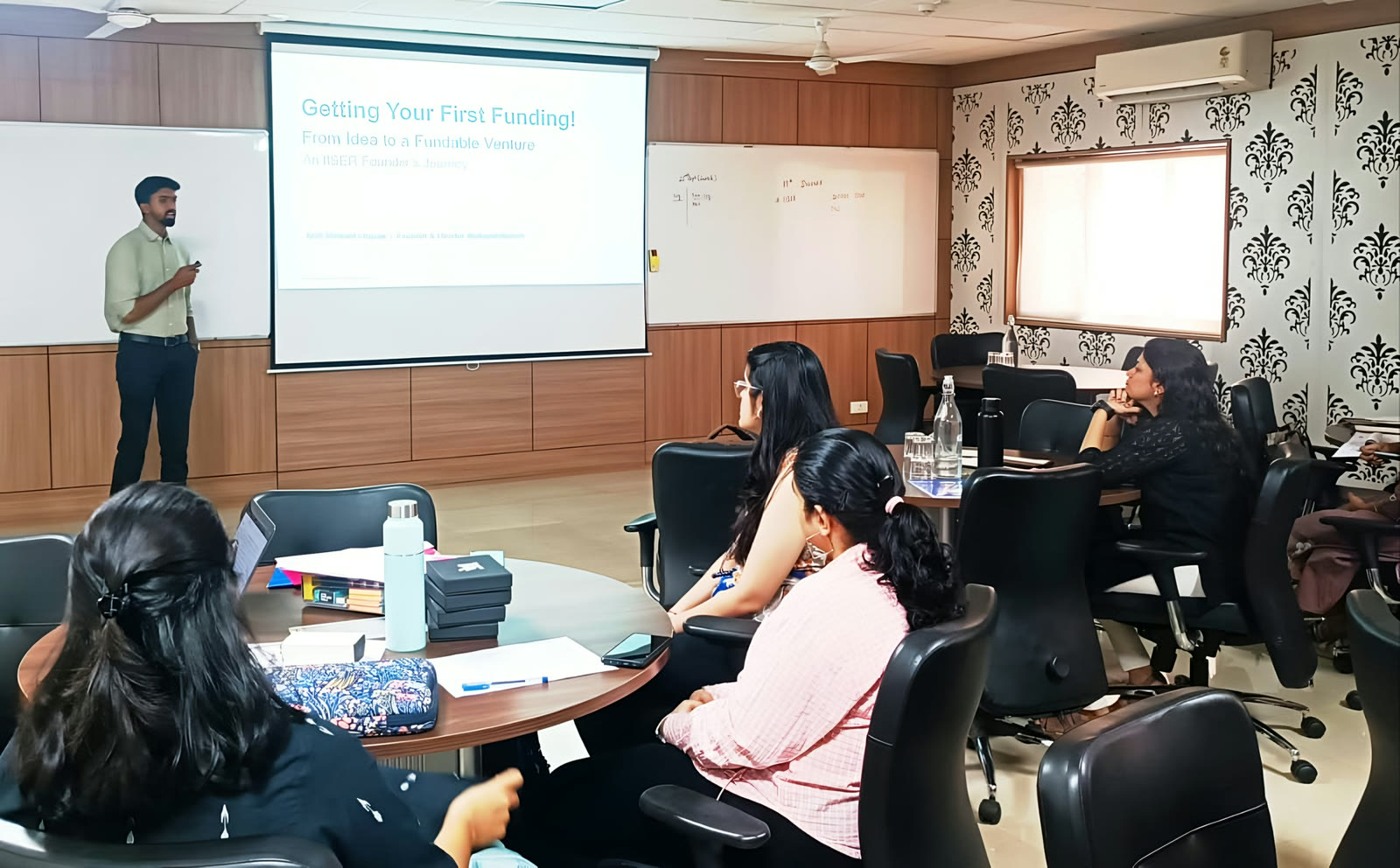 Arsh presenting 'Getting Your First Funding: From Idea to a Fundable Venture' to a room of students